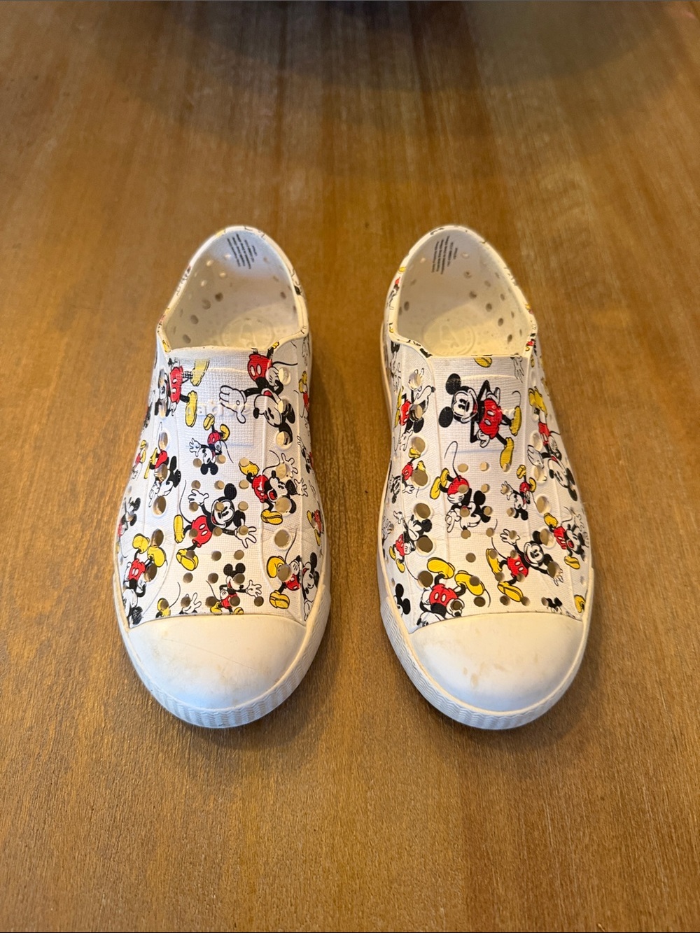 Native Kids Slip-On Sneakers in White with Red, Yellow & Black Mickey Print